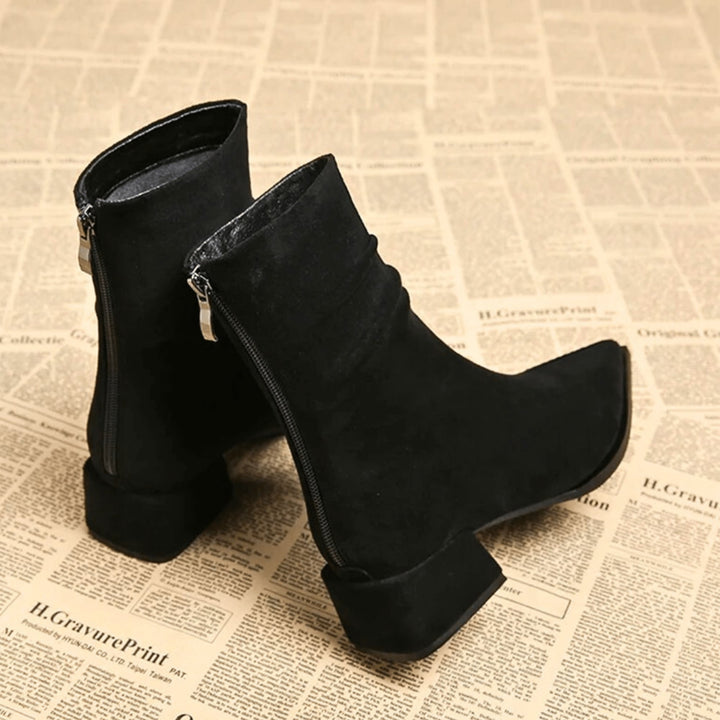 Overhead flat-lay of Valeria boots in brown and black side by side