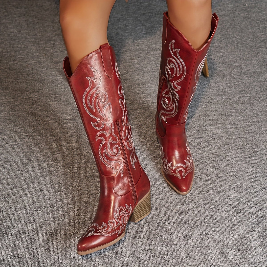 Brown Winter Grace boots styled with a midi skirt for a feminine winter look