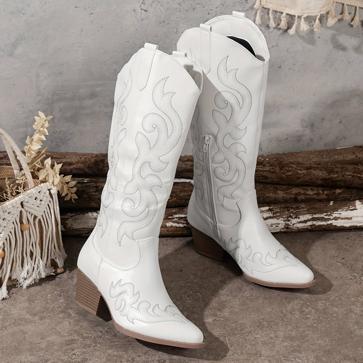 Overhead flat lay of all Winter Grace boot colors on a light neutral surface