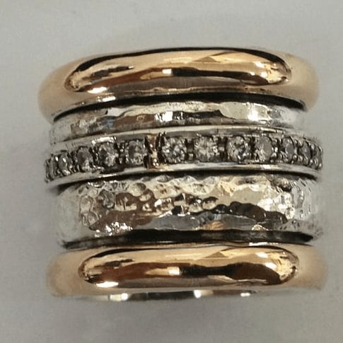 Vintage layered thick gold ring shown in a close-up product shot highlighting its bold, stacked band design