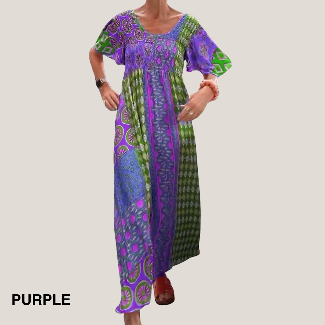 Front view of the paisley midi dress showing the flowing fabric and flattering midi length in purple