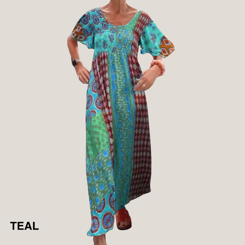 Close-up of the paisley print detail on the lightweight midi dress in teal