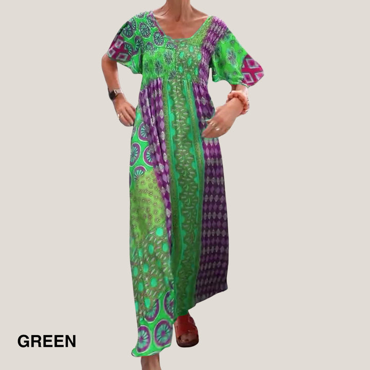 Full-length shot of the paisley midi dress in light green, highlighting the breathable fabric and midi length