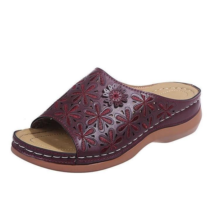 Vanilla flat sandals in black showing strap closure and cushioned sole detail