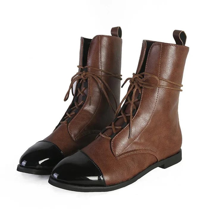 Brown vintage-inspired boots showing side profile and pointed toe detail