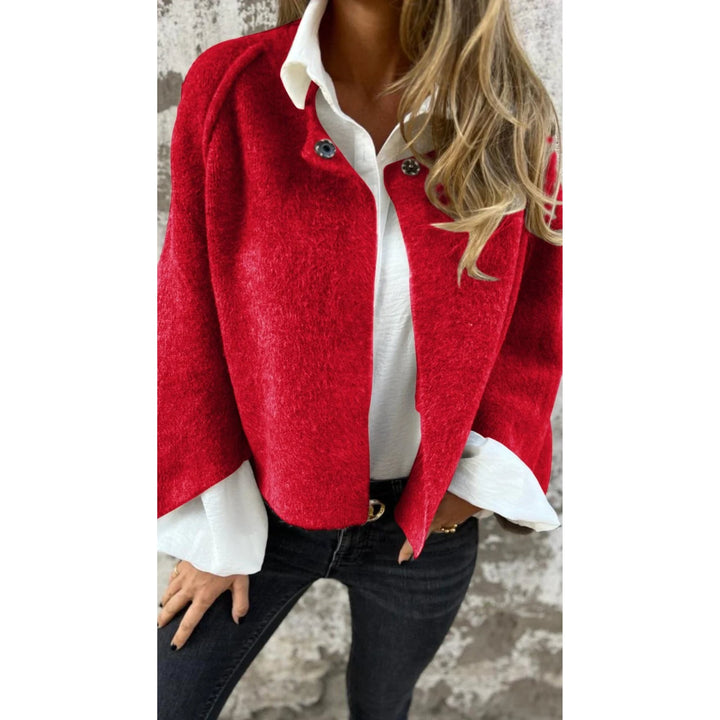 Woman modeling a timeless elegant coat available in beige, black, and red colorways