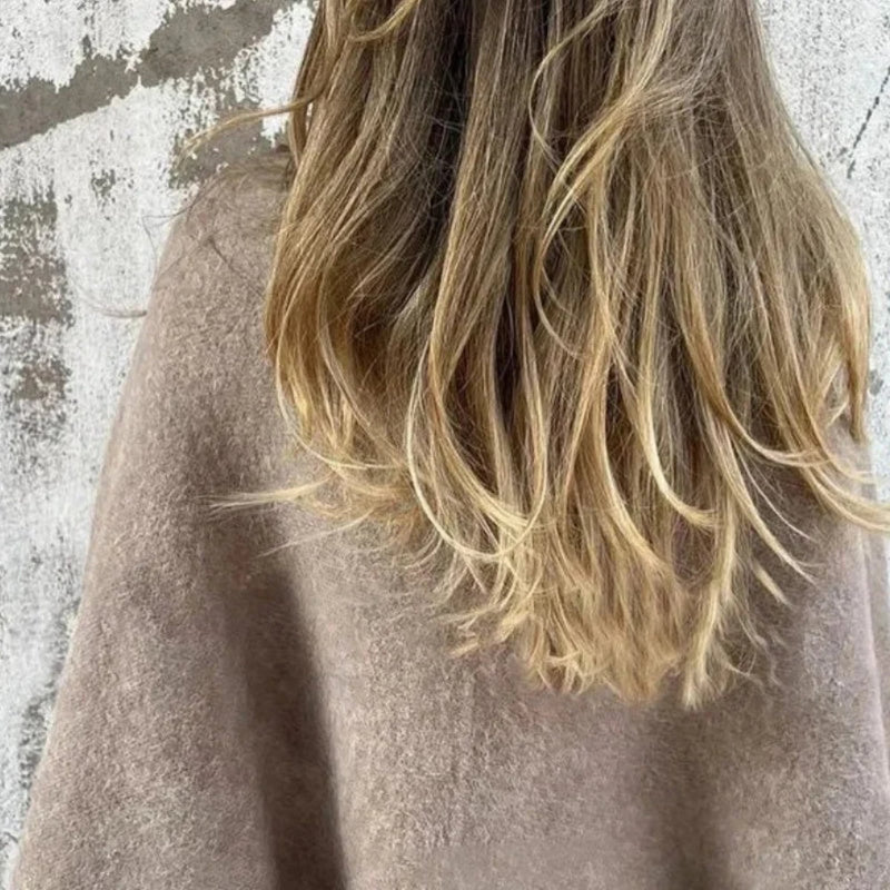 Close-up detail of the round neckline and premium fabric of the Florimay elegant coat