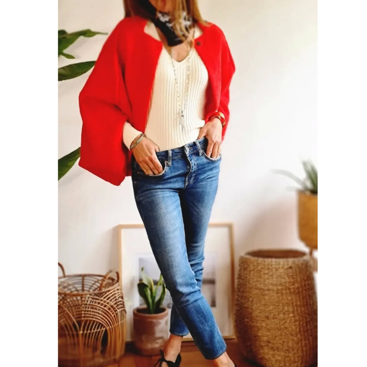 Woman wearing a beige elegant coat paired with a sleek outfit for a polished look