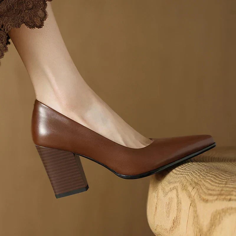 Venetia brown block heel pump worn on foot, side profile view