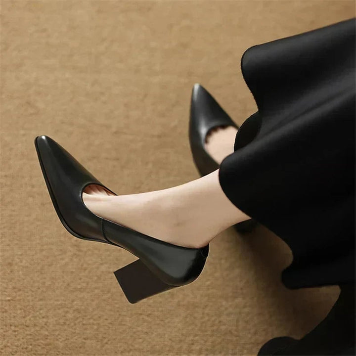 Venetia black block heel pump with pointed toe, side view on white background