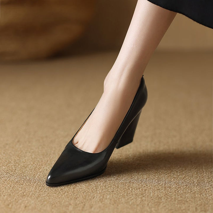 Venetia black block heel pump angled front view showing pointed toe silhouette