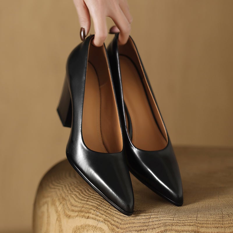 Venetia black block heel pump pair flat lay on neutral background
