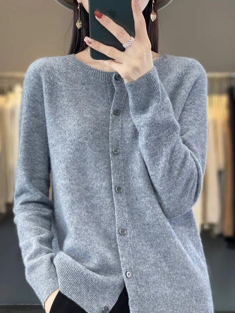 Close-up of elegant button front detailing on a soft knit cardigan