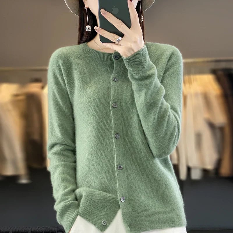 Detail shot of soft knit fabric and button accents on a versatile women's cardigan