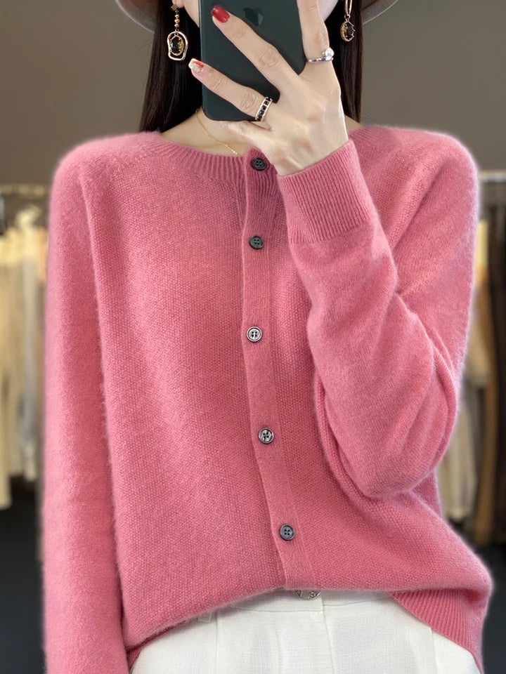 Buttoned cardigan laid flat showing overall shape and button front detail