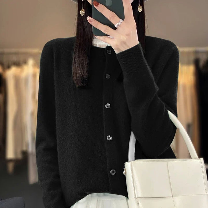 Model wearing the buttoned cardigan in a dark colorway, styled for a chic everyday look