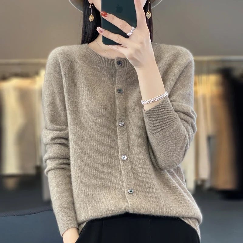 Lifestyle shot of a woman wearing a cozy buttoned cardigan, perfect for layering any season