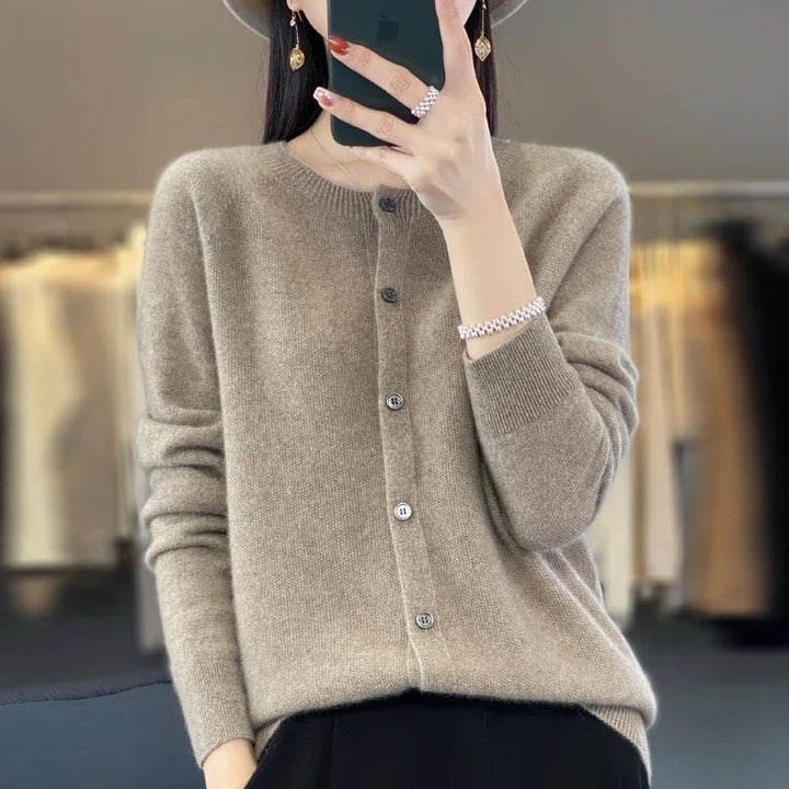 Lifestyle shot of a woman wearing a cozy buttoned cardigan, perfect for layering any season