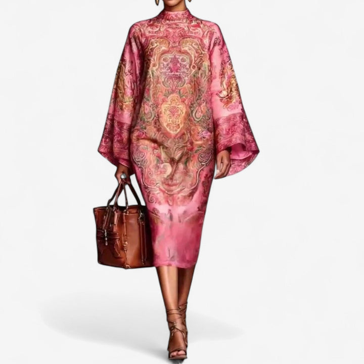 Woman wearing a pink printed caftan dress with a vibrant colorful pattern, flowing silhouette, relaxed fit