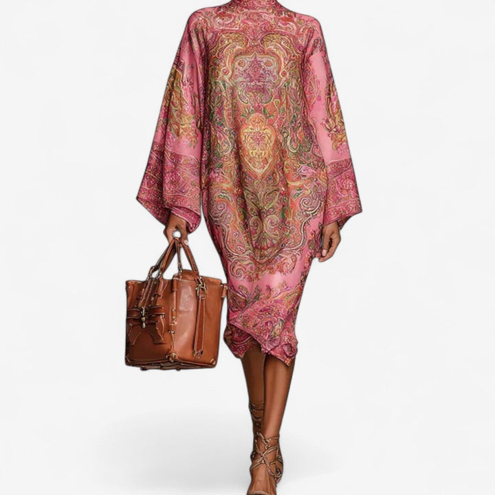 Side view of the pink printed caftan dress highlighting the graceful drape and relaxed silhouette