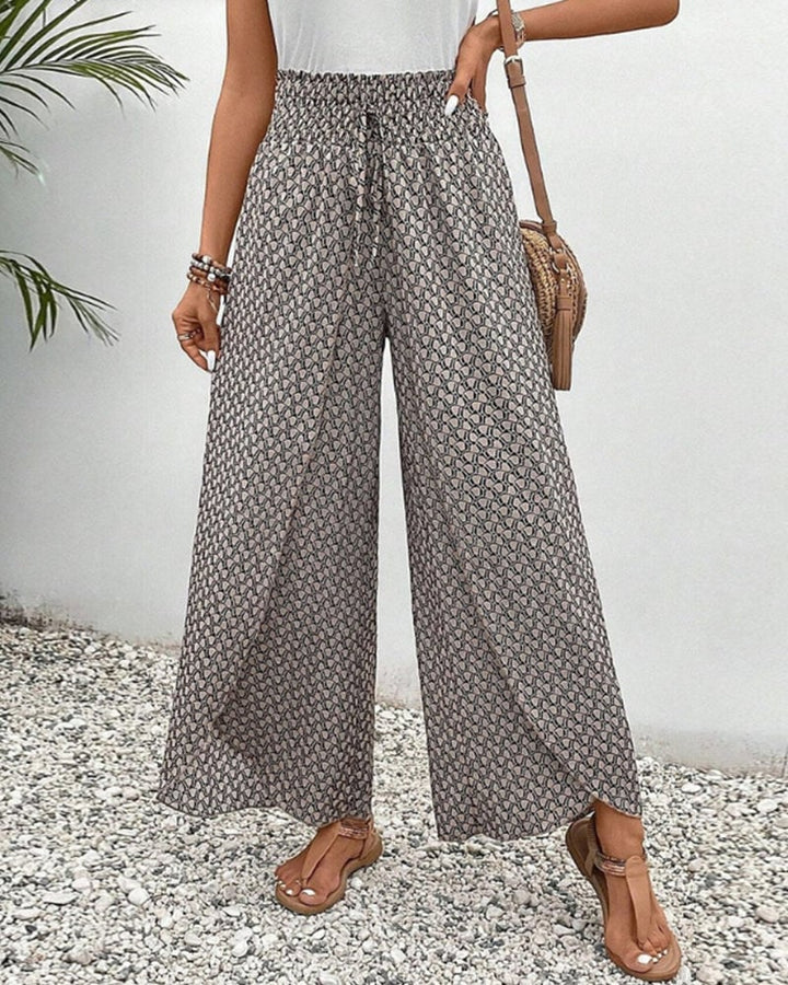 Gray wide-leg geometric print trousers with relaxed fit, front view