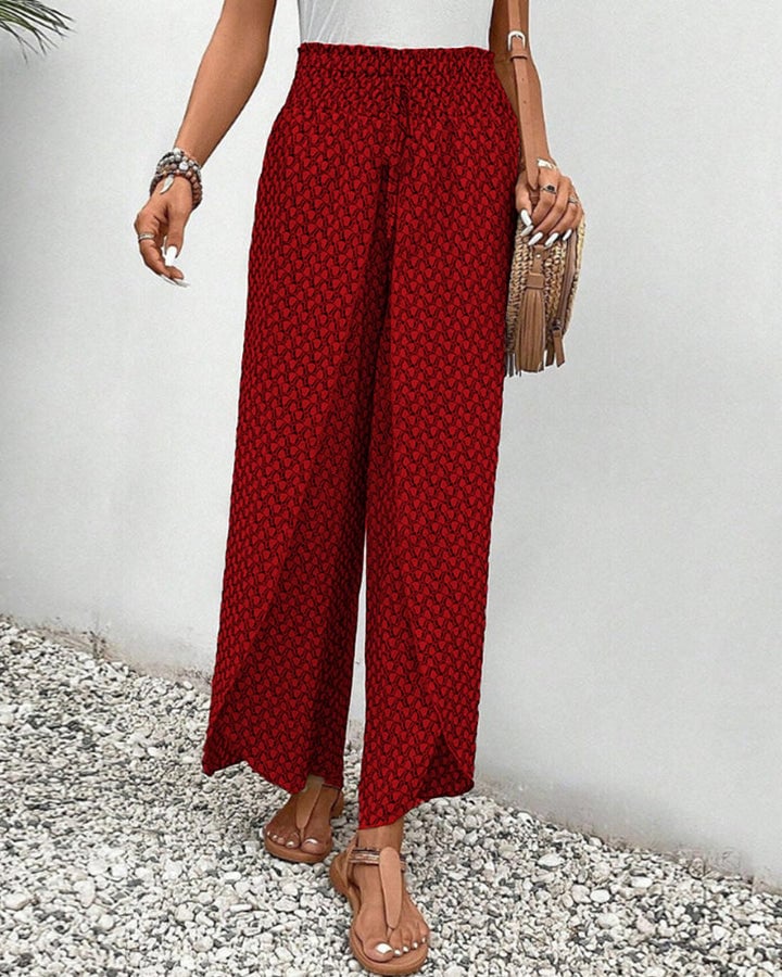Full-length shot of gray geometric print trousers showing elongated leg line