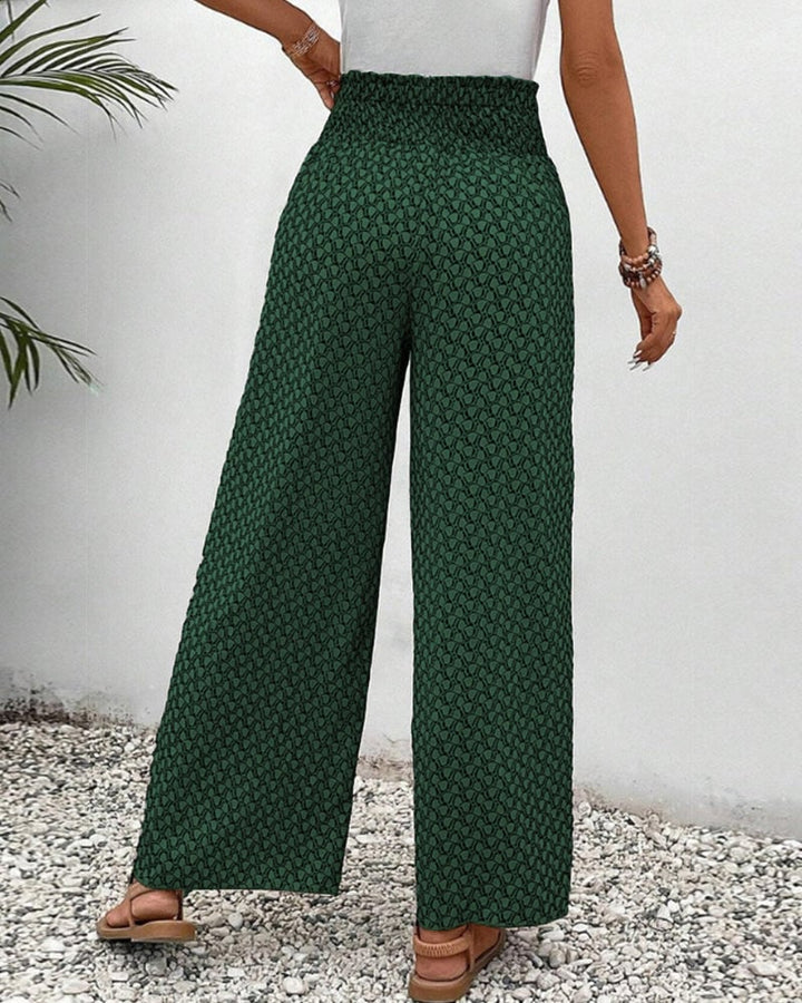 Flat lay of all three color options: gray, red, and green geometric trousers