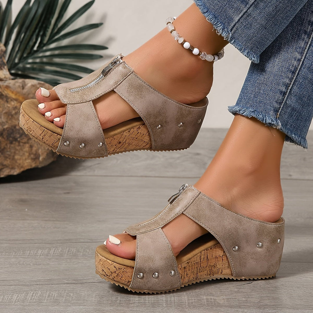 Vera platform wedge sandals in light brown, back view highlighting zip closure