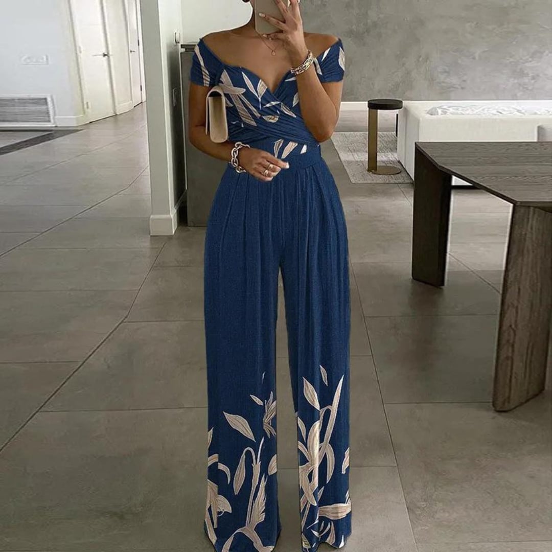 Side view of the Vera wide-leg jumpsuit highlighting the cinched ruched waist and elongating silhouette