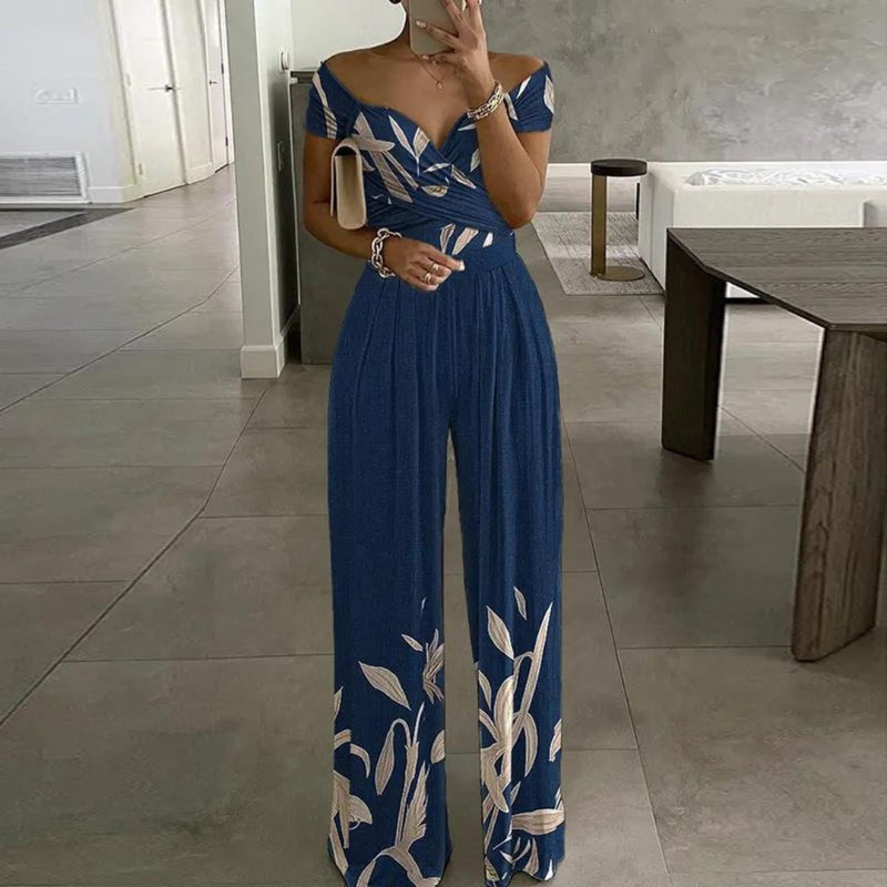 Side view of the Vera wide-leg jumpsuit highlighting the cinched ruched waist and elongating silhouette