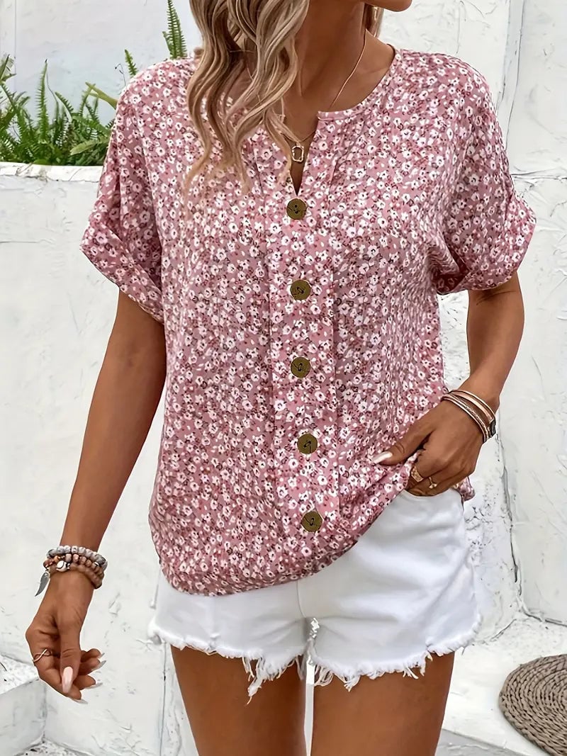 Full-length view of a woman modeling the floral print blouse styled with casual bottoms
