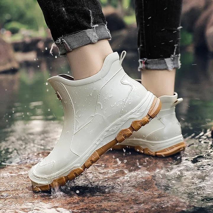 Pair of Canyon rain boots standing upright against a neutral background