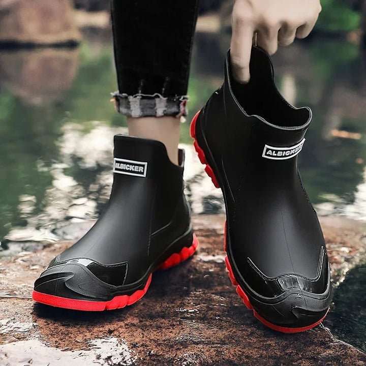 Overhead flat-lay of all three Canyon rain boot color options: black, beige, and black/red