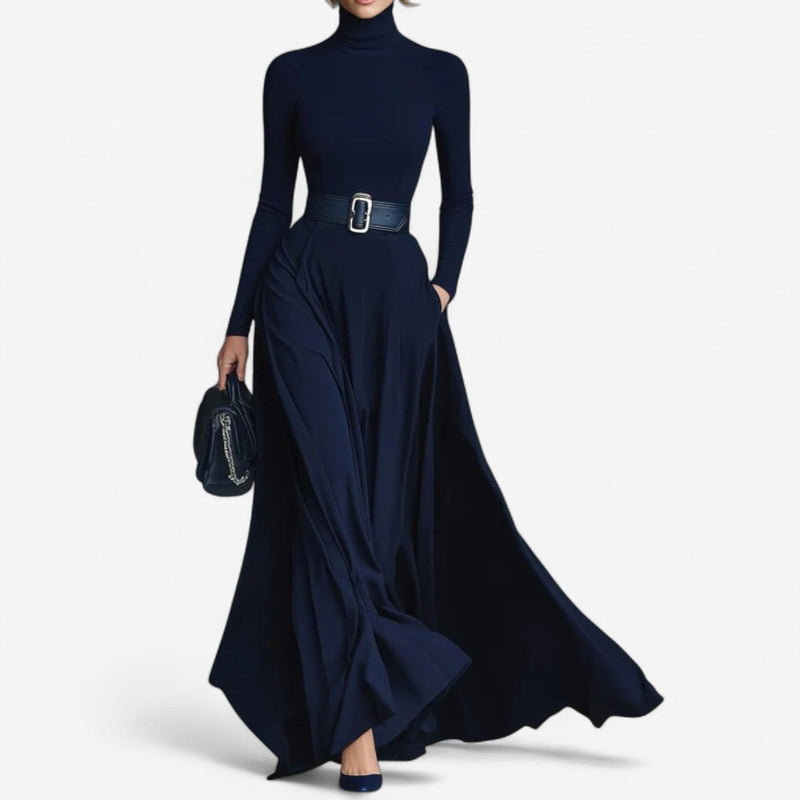 Woman wearing a blue high neck maxi dress with a flowing floor-length silhouette, front view
