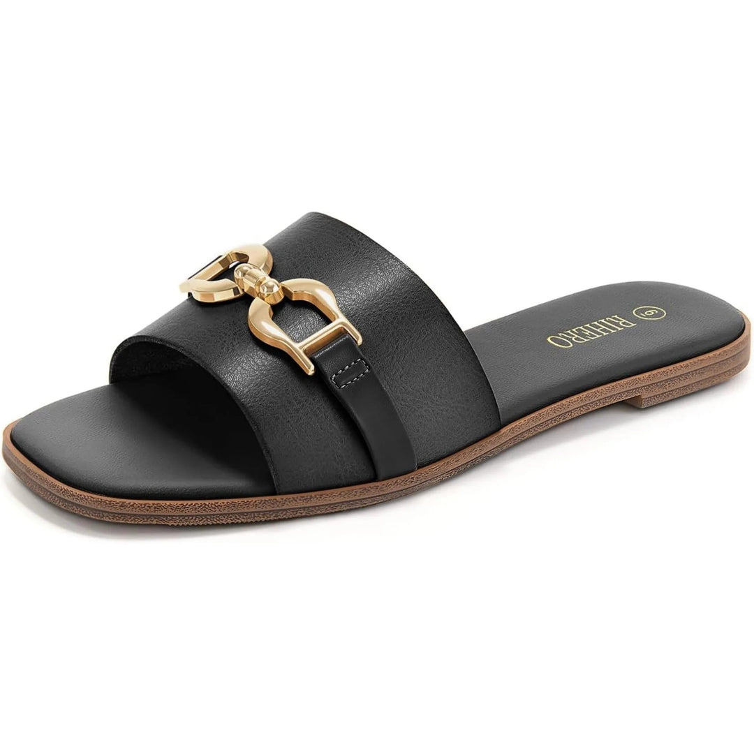 Close-up of gold buckle detail on Veronica women's sandals against a neutral background