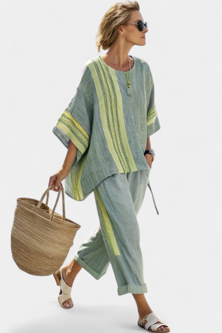 Front view of the Via linen set showing the zip neckline detail and contrasting stripe trim on the short sleeves