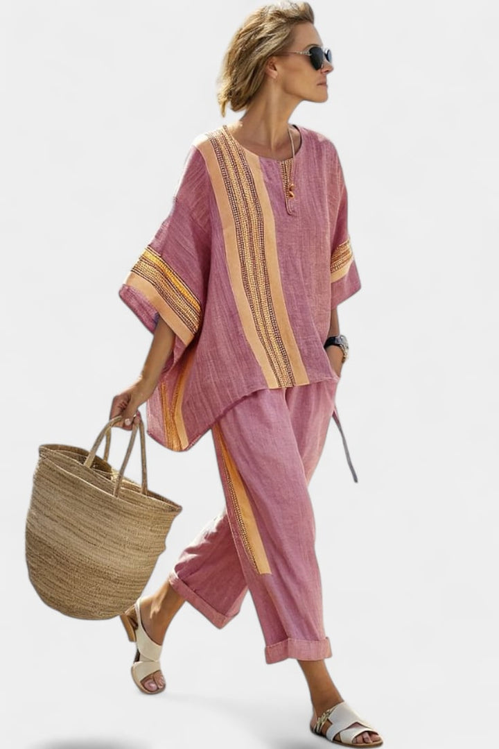 Close-up of the woven mustard stripe trim along the sleeve and front of the Via linen oversized top
