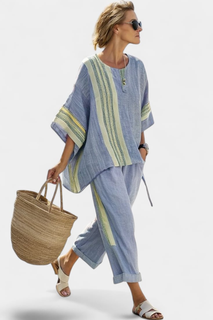 Back view of the Via linen two-piece set in green showing the relaxed silhouette of the top and tapered pants