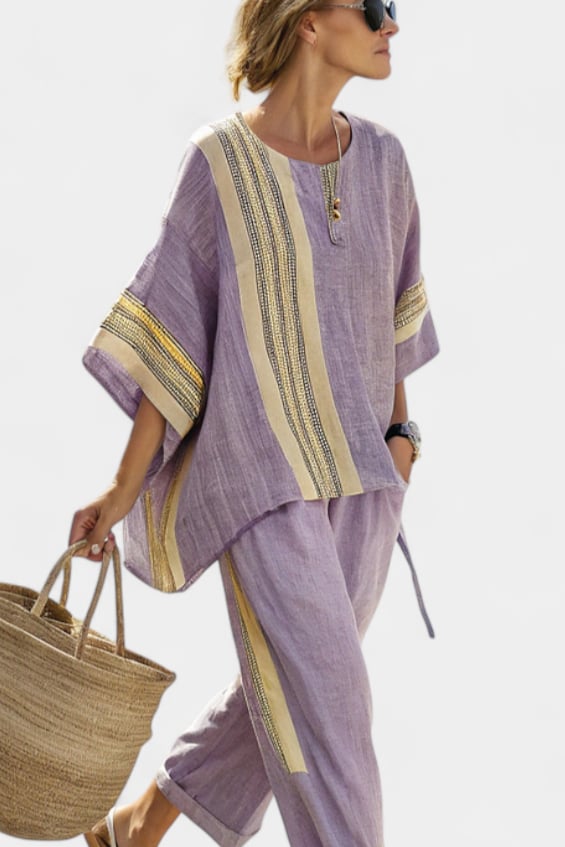 Flat lay of the Via linen two-piece set showing both the oversized top and tapered pants in yellow