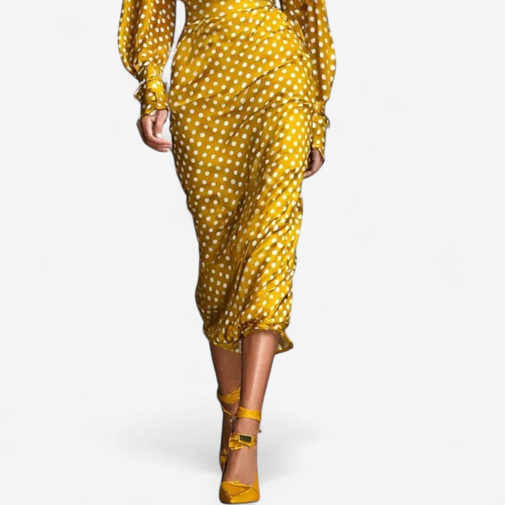 Close-up detail of the Vicky classic elegant gold dress fabric and streamlined fit