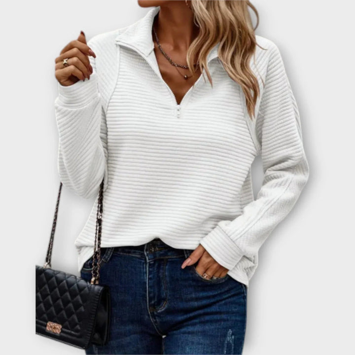 Close-up detail of the Victoria halfzip pullover showing the adjustable zip neckline and soft fabric texture