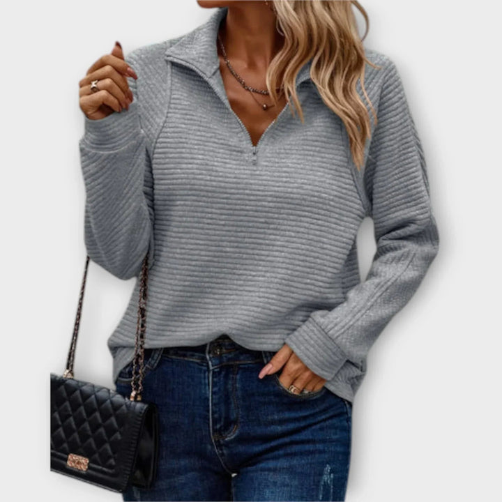 Victoria halfzip pullover displayed to highlight its flattering relaxed silhouette and clean finish