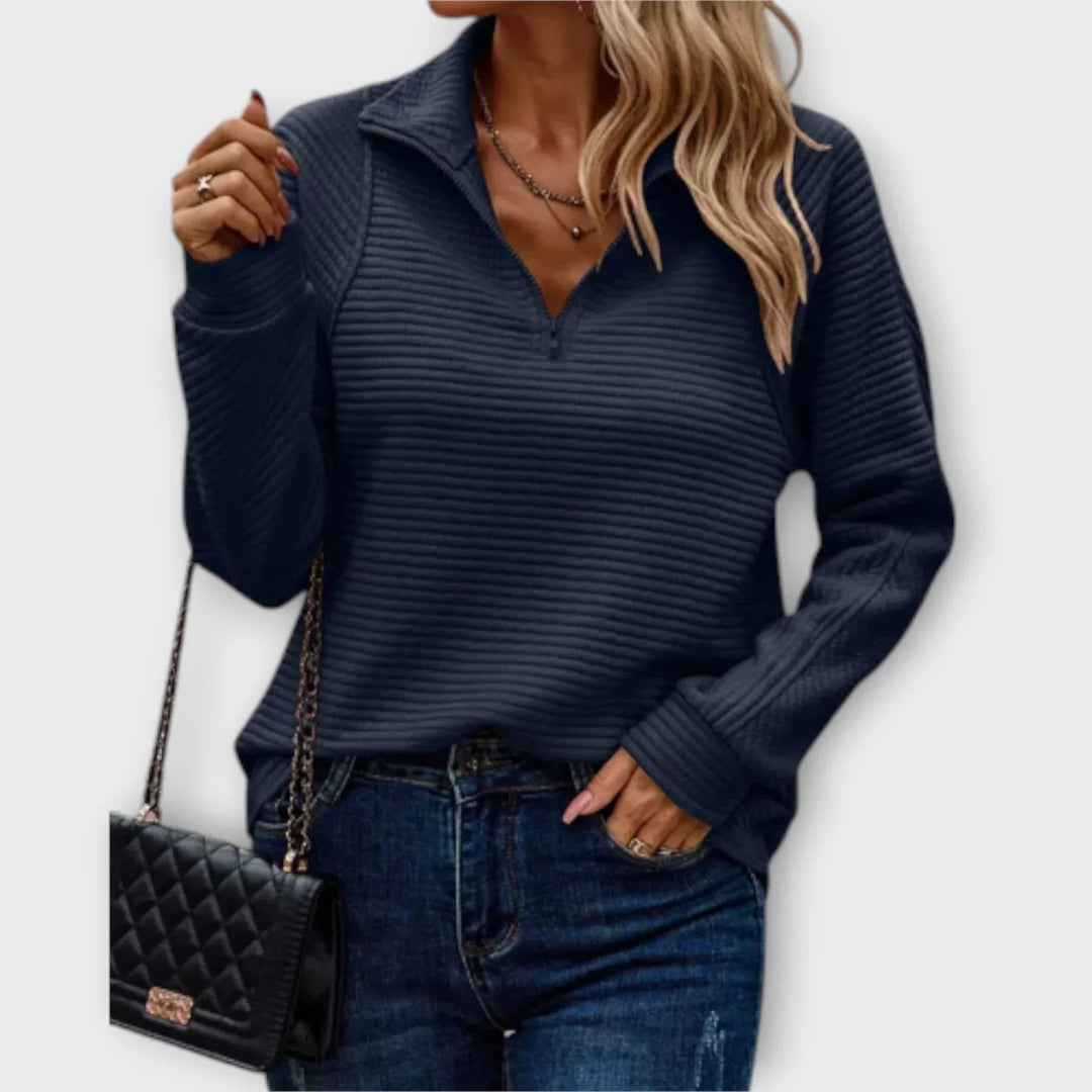 Victoria halfzip pullover styled with jeans, showcasing its versatile sporty-chic look
