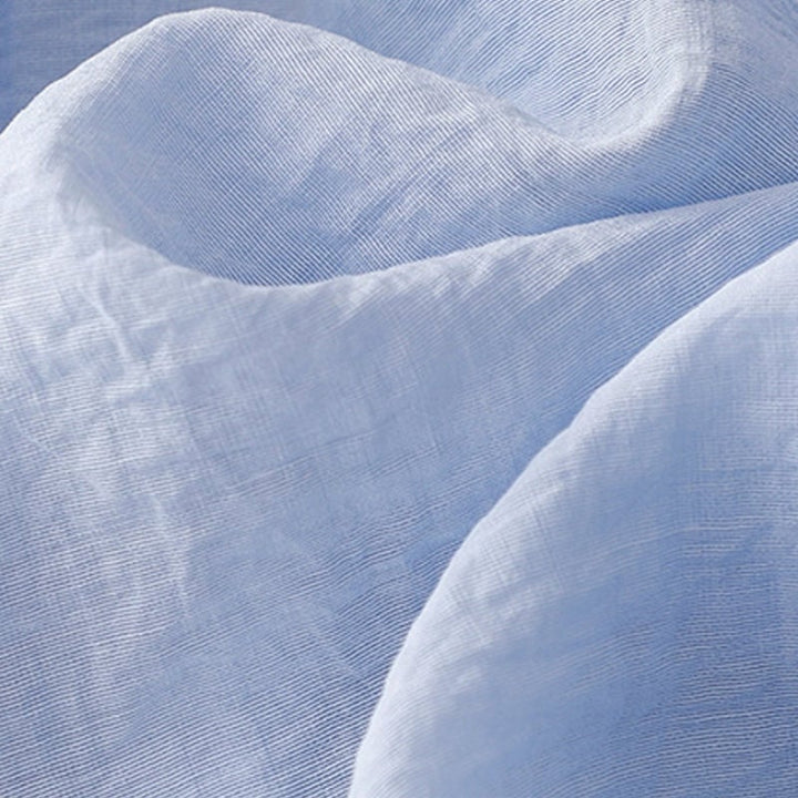 Close-up of the button-front detailing and soft hooded neckline on the lightweight warm-weather hoodie