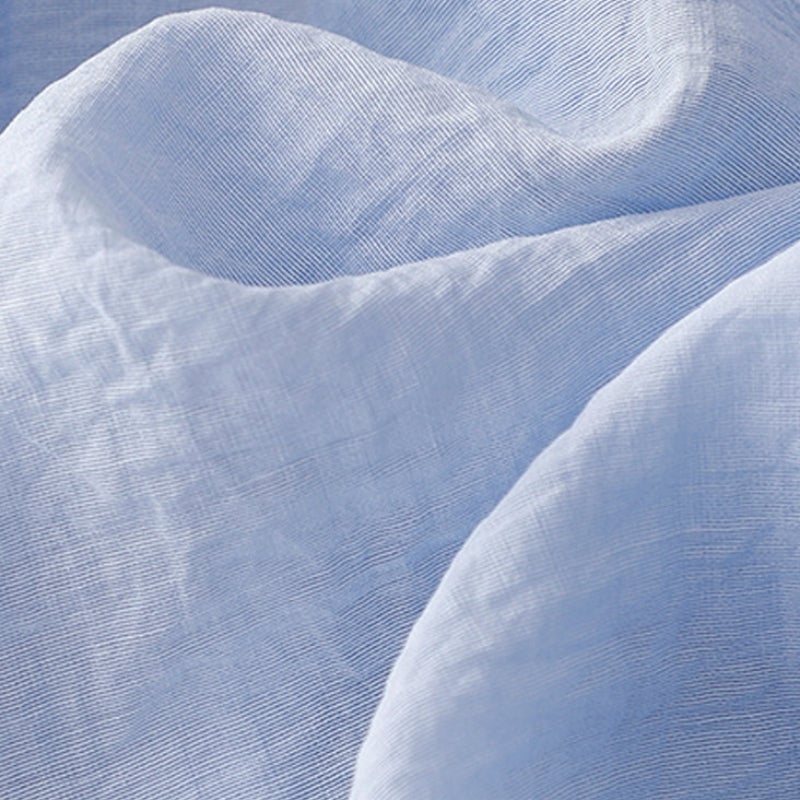 Close-up of the button-front detailing and soft hooded neckline on the lightweight warm-weather hoodie