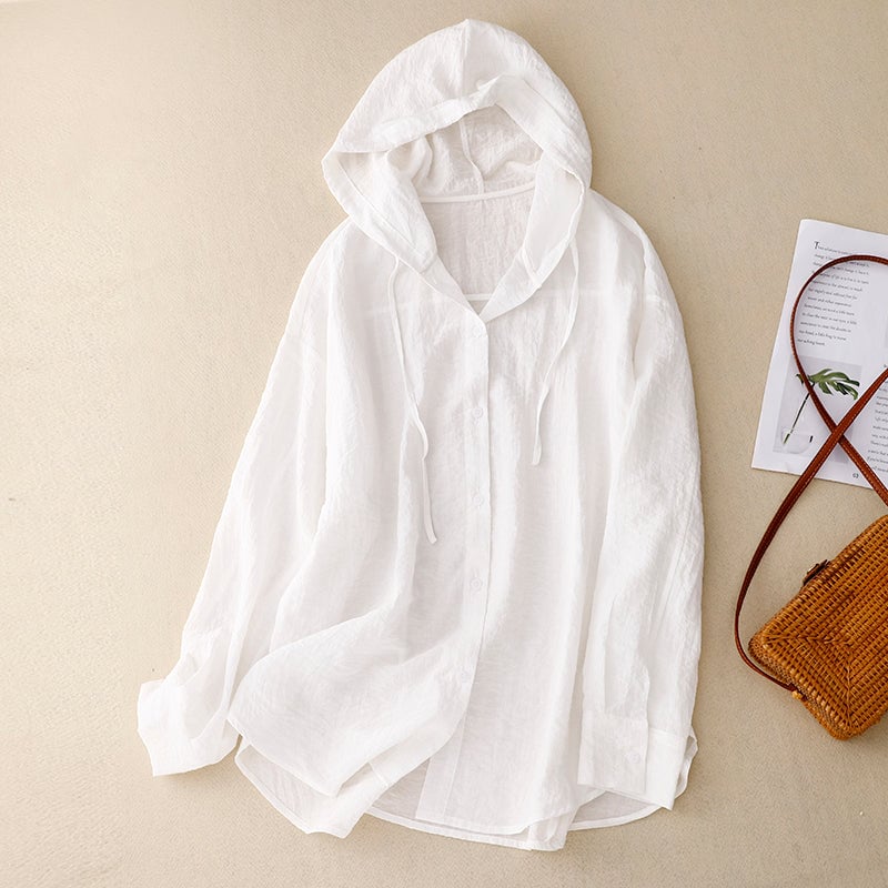 Woman wearing the blue lightweight button hoodie in a relaxed, easy-fit silhouette perfect for layering