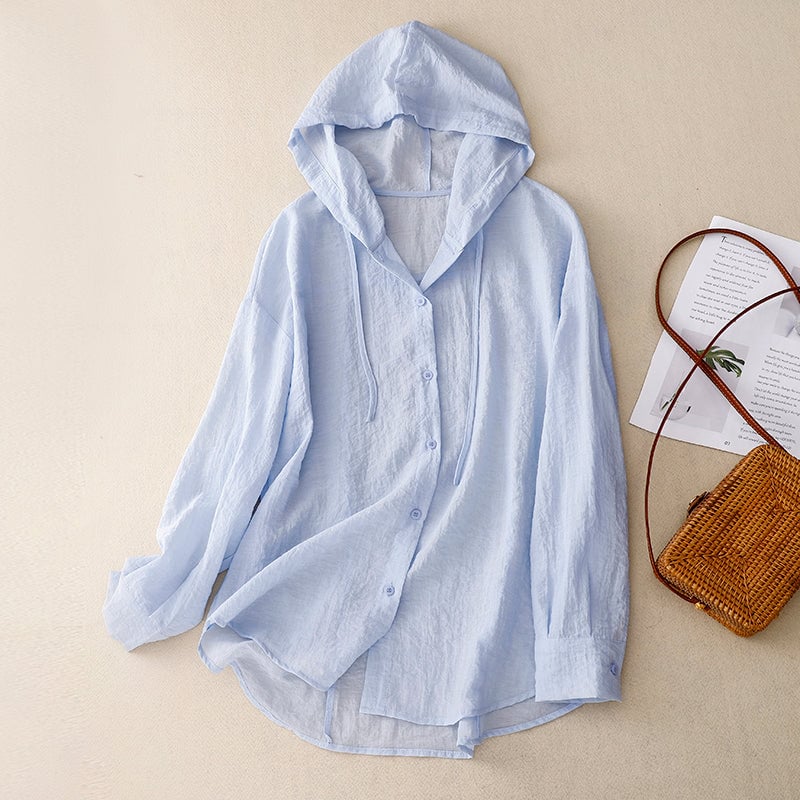 Flat lay of the lightweight button hoodie in multiple colors — purple, white, and blue — on a clean background