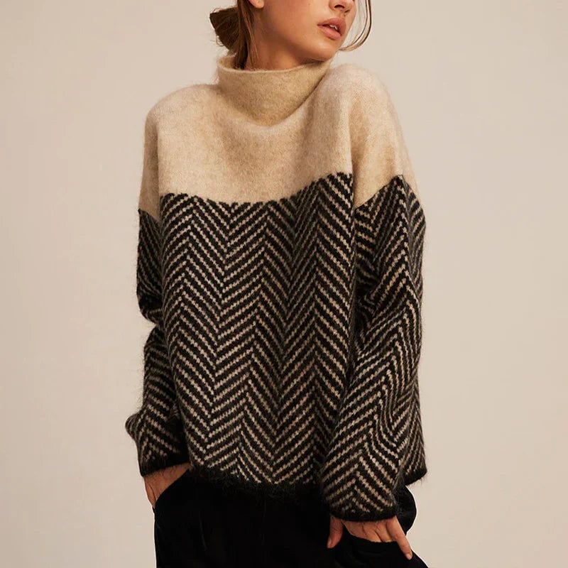 Woman wearing a soft beige turtleneck sweater with subtle chevron detailing, styled casually