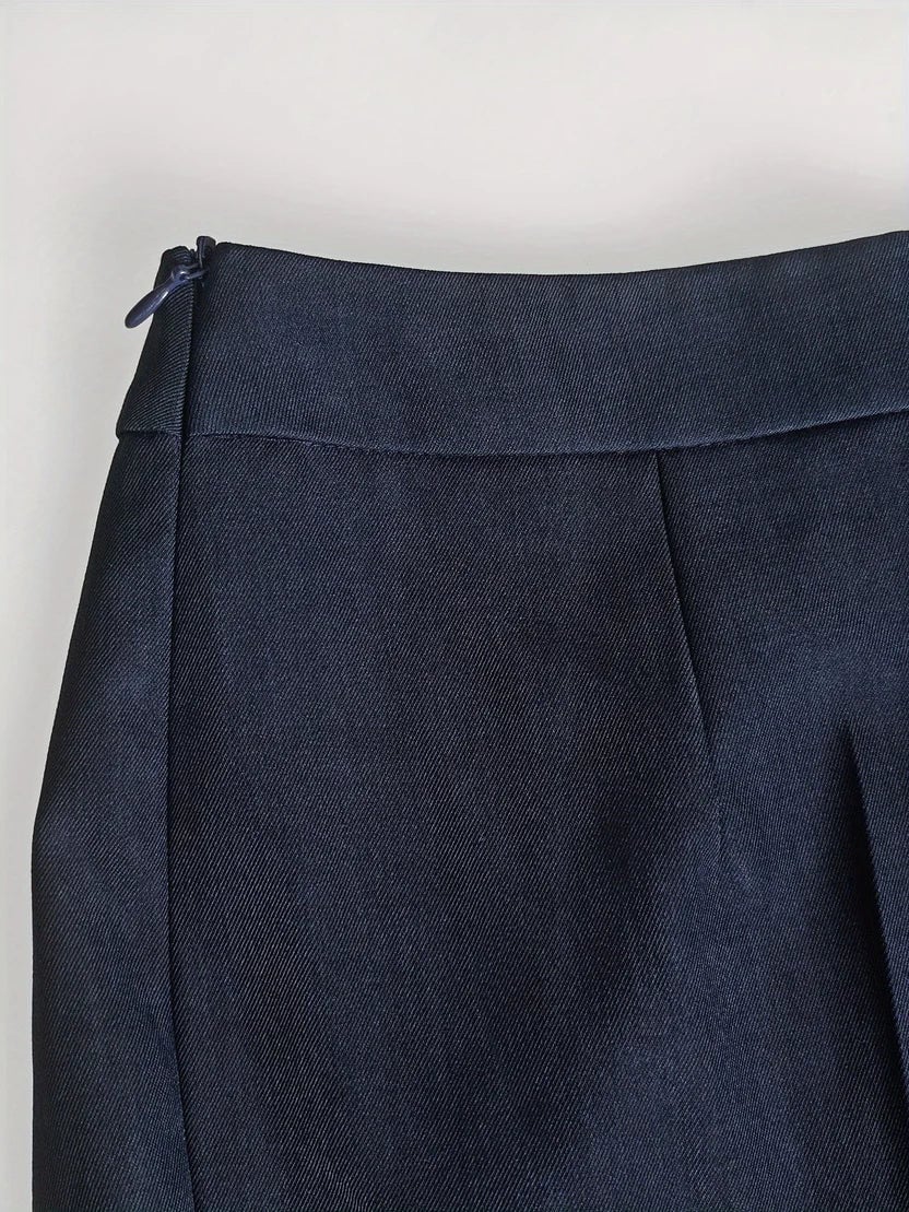 Close-up of the Vina blazer flap pocket and single-button waist closure detail