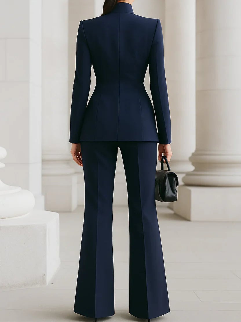 Vina suit set in white showing the stand collar neckline and tailored fit